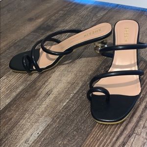 Black and gold heels